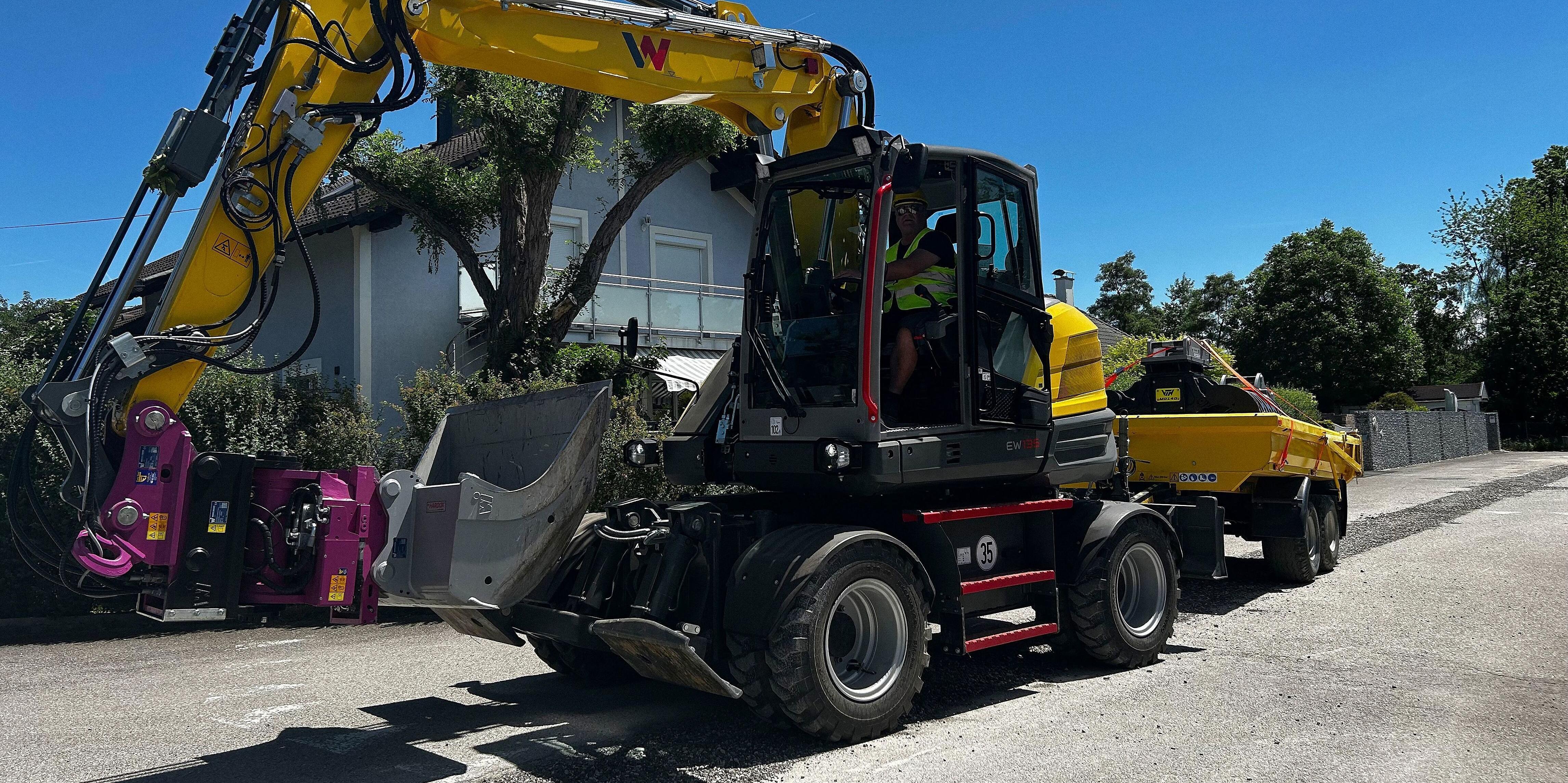 excavator EW135 on street with Trailer