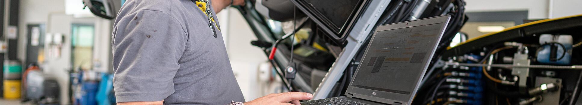 wacker neuson employee checks machine