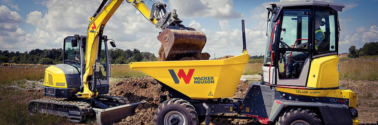 An excavator and a dumper working together